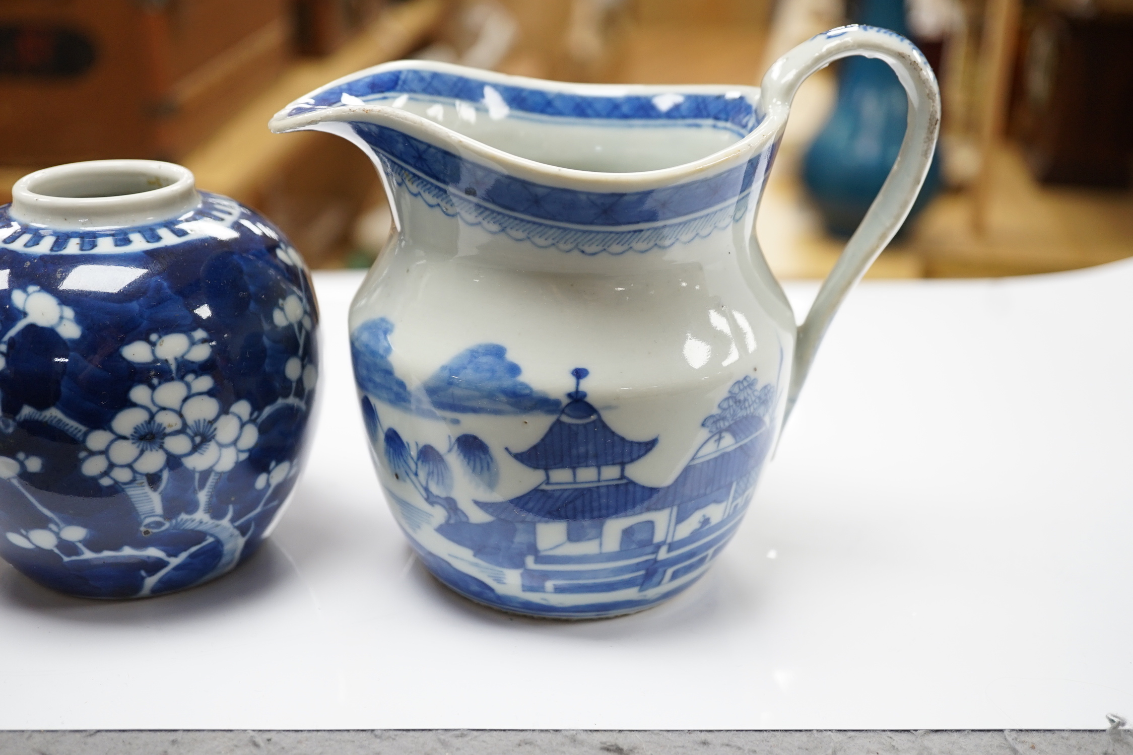 A 19th century Chinese blue and white jug, a similar jar and a pierced jar, tallest 15cm